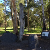 Image: boulders with sculpture and plaques mounted on them