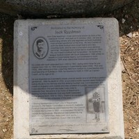 Image: Black and white plaque at foot of fountain