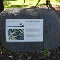 Image: Large graphic plaque set into granite boulder