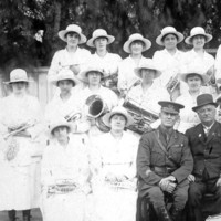 Image: group photo women with instruments, men in uniform