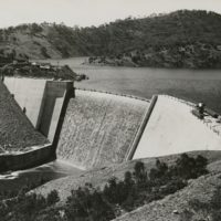 Image: Black and white photograph of dam and reservoir, before completion, circa 1938