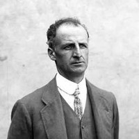 Image: A photographic portrait of a man wearing a suit with waistcoat