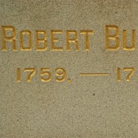 Text engraved in stone reading Robert Burns 1759-1796