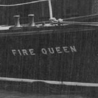 Image: A small motor launch with water cannons and the name ‘Fire Queen’ emblazoned on its bow sits stationary in a river