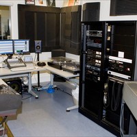 Image: audio preservation room filled with computers and other equipment such as playback systems