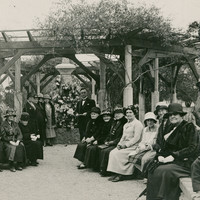 Image: group of people gathered under gazebo