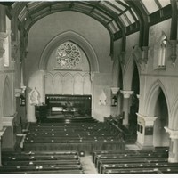 Image: Inside the Stow Memorial Church. The image shows an altar, pews and the English Gothic architectural elements of the building.