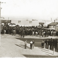Image: men and horses gathered in a crowd for a strike