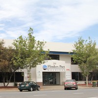 Large concrete and glass building with sign, Flinders Ports