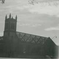 Image: a church with roof tiles removed. 
