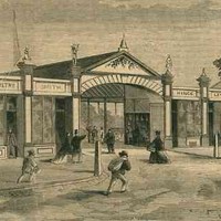 Image: A drawing of a row of mid-19th century shops with women and men, one on a horse, heading towards them. The shops include a draper, a smith, a butcher and others.