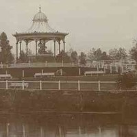 Image: A rotunda sits on a hill in a landscaped park on the bank of a river