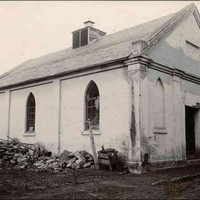 Image: black and white shot of simple, worn chapel