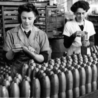 Image: two women looking at bombs