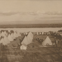Image: black and white photo of group of tents