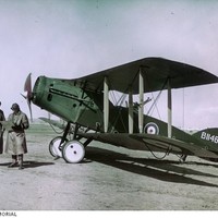 Image: Colour photo of two men and an aircraft