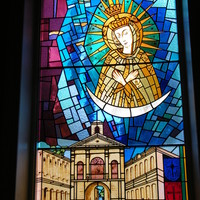 Stained glass window of the Blessed Virgin Mary and the Gates of Dawn.