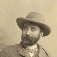 Image: sepia image of seated man wearing hat