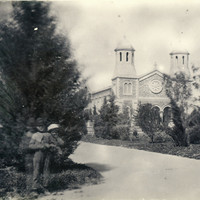 Image: View of a group of children in garden with church in the background