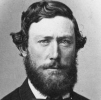 Image: head and shoulders portrait of a man with a beard