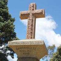 Image: stone cross in park land