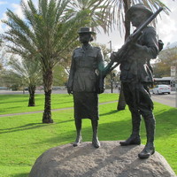 Image: bronze sculpture of man and woman in uniform