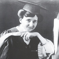 Image: Woman dressed in graduation gown and mortarboard