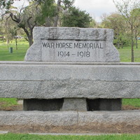 Image: large concrete trough engraved with memorial dates