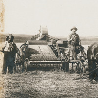 Image: Photograph of farmers and horses pulling a harvester