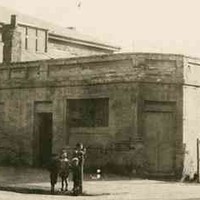 Man and children standing in front of the old Albion Hotel, Morphett Street c.1910