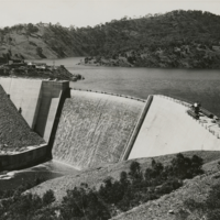 Image: Black and white photograph of dam and reservoir, before completion, circa 1938
