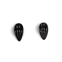 Image: two small metal pins in teardrop shape with black and white stripes