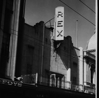 Image: Facade of building with prominent sign declaring Rex Theatre