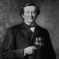 Image: A painted portrait of a middle-aged Caucasian man wearing a mid-19th century coat and bowtie. Three medals are pinned to the left breast of his coat
