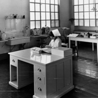 Image: woman in nursing uniform working
