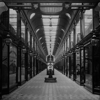 image: interior of an ornate 19th century shopping arcade