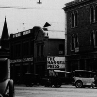 Image: View of shop fronts and cars along currie street