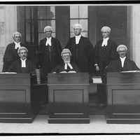 Image: Seven bewigged and robed supreme court judges, seated and posing for photograph, 1915
