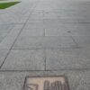 Image: bronze name plaques in pavement