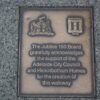 Image: bronze plaque with logos and text