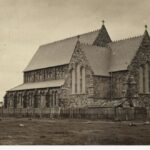 Image: Gothic Revival church near a tree