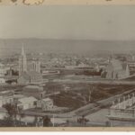 Image: Elevated view of multiple church buildings in an early city settlement