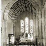 Image: View of church interior, including altar and stained glass windows