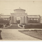 Image: Sepia photograph of glasshouse on raised earthen platform