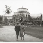 Image: Well-dressed visitors to glass house in botanic garden