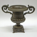 Image: Hellenic vase shaped bronze urn on square base