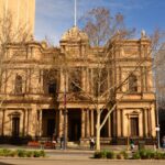 Sandstone fronted building featuring a number of Italianate pillars