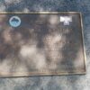 Image: Metal plaque mounted on a granite base.