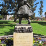 Image: Bronze statue of girl on sandstone plinth inscribed "ALICE for the children from Josephine and Norman Lewis 1962"