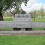 Image: large concrete trough engraved with memorial dates